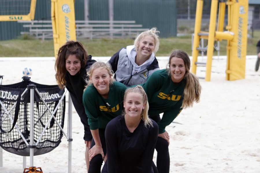 Beach+Volleyball+players+pose+for+photo+at+practice.+The+ladies+are+ready+to+take+UNO+in+the+season+opener+on+Nov.+11.+