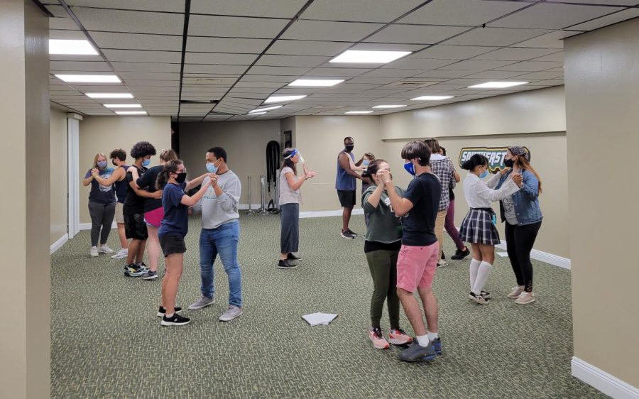 In the University Center, student actors learn the waltz for a wedding scene in Big Love during rehearsal.