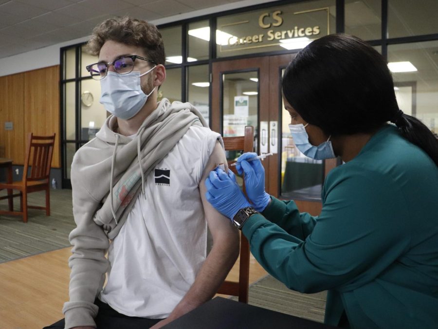 A Southeastern student receives a COVID-19 vaccine from a nursing student during an on-campus pop-up vaccine event in the Spring 2021 semester.