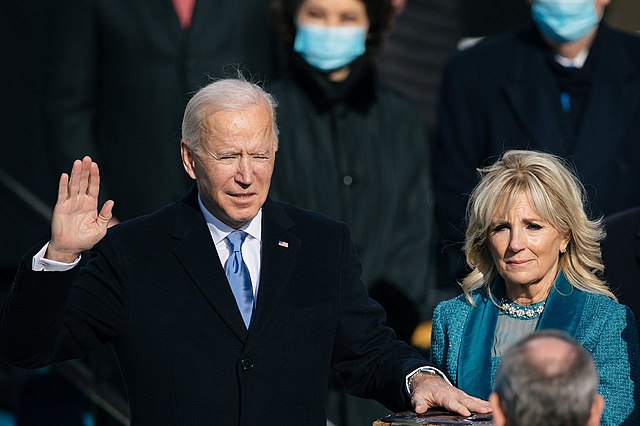 Standing next to his wife Jill Biden at the presidential  inauguration ceremony, Joe Biden swears in to become the 46th President of the United States on Jan. 20, 2021 in Washington, D.C.
