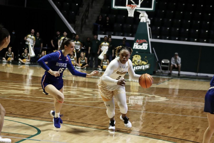 Senior guard/forward Morgan Carrier dribbles the ball down the court to move past the Lady Huskies defense. The Lady Lions fell 51-40 to Houston Baptist on Feb.  12.