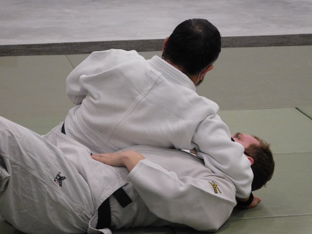 Dr. Yoshida and Leighton Webre giving a takedown demonstration during class. The Judo class is located in the Kinesiology and Health Studies building in room 150. 
