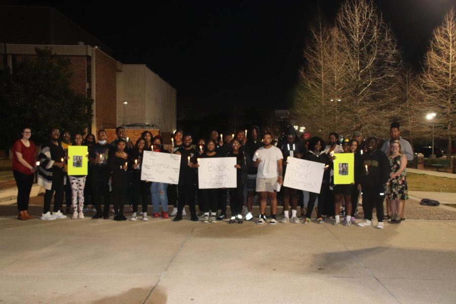 Participants in BSUs candlelight visual stood together to remember those whove fallen victim to police brutality.