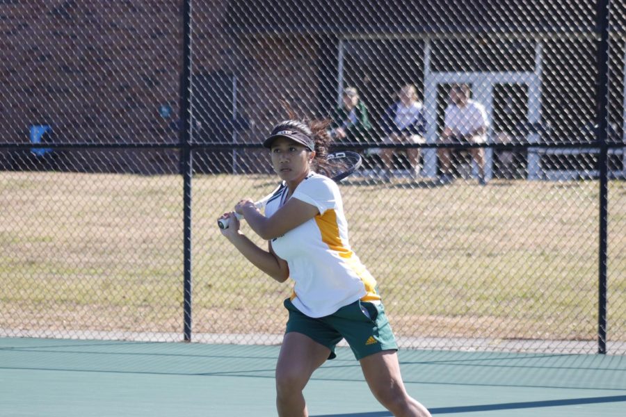 Junior Putri Insani returns a serve during the Feb. 15 home match against the Alcorn State Braves. The Lady Lions fell 3-4.