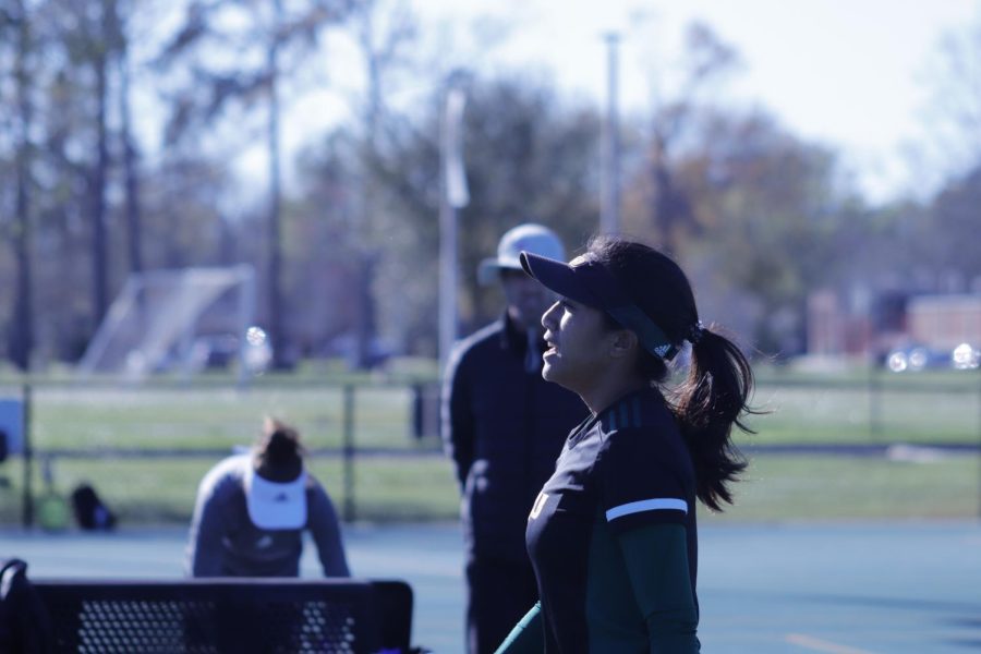 Putri Insani walking off the court for a break in between her match. Insani was the only Lady Lion to win a singles match during the March 12 game. 