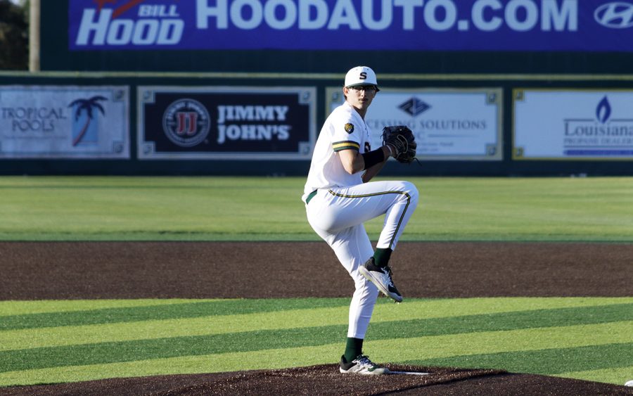 Adam Guth, freshman pitcher and Lake Charles native, winds up his pitch for the number one ranked Ole Miss batter. 