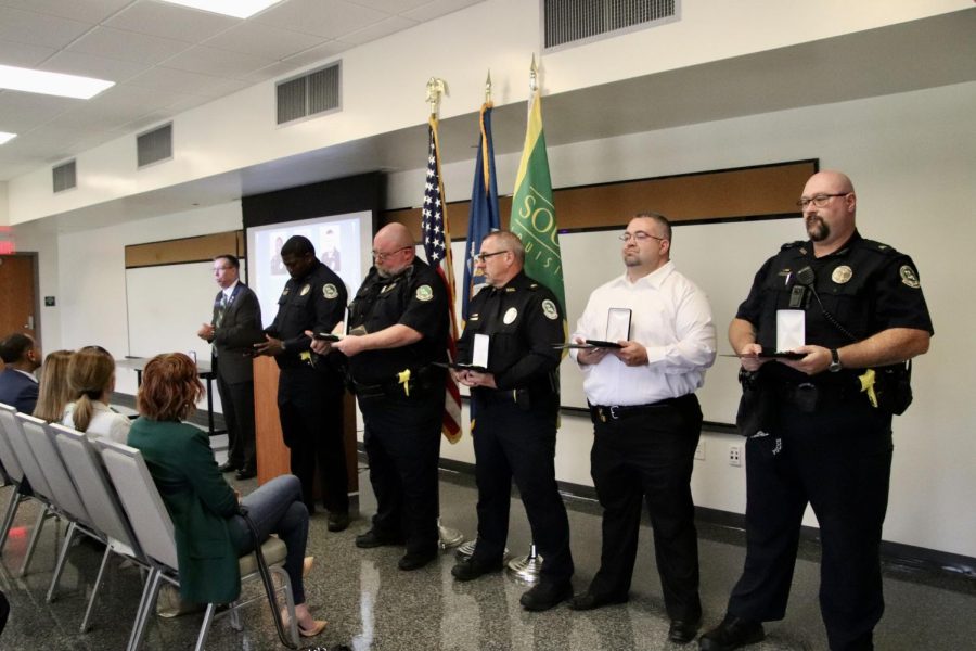 From left to right: UPD Chief Michael Beckner presents the Chiefs Award for Courage to officers Tyrone Garrison, David Miller and Tyler Theard (not pictured) and sergeants Ronald Plaisance, Johnathan Edwards and William Smith for their actions in response to the May 19 shooting at the University Center.