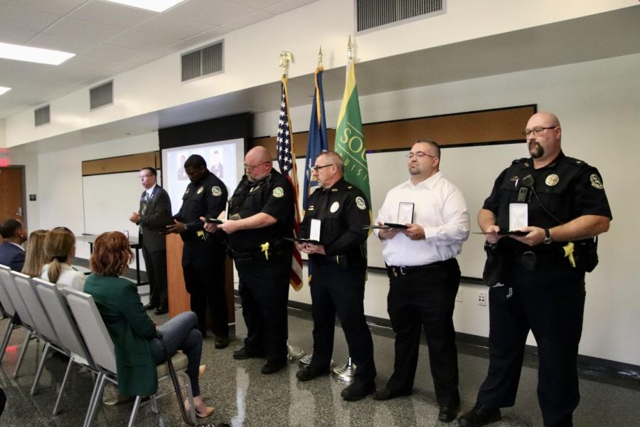 From left to right: UPD Chief Michael Beckner presents the Chief's Award for Courage to officers Tyrone Garrison, David Miller and Tyler Theard (not pictured) and sergeants Ronald Plaisance, Johnathan Edwards and William Smith for their actions in response to the May 19 shooting at the University Center.