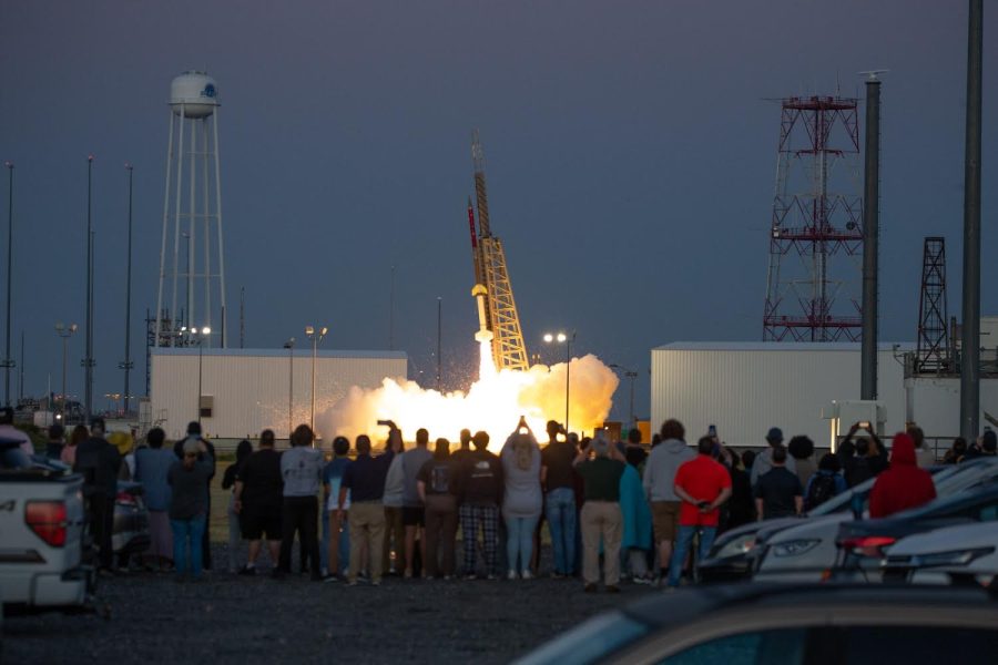 Students record the rocket as it launches into the sky awaiting the star-bright data they hope to retrieve.
