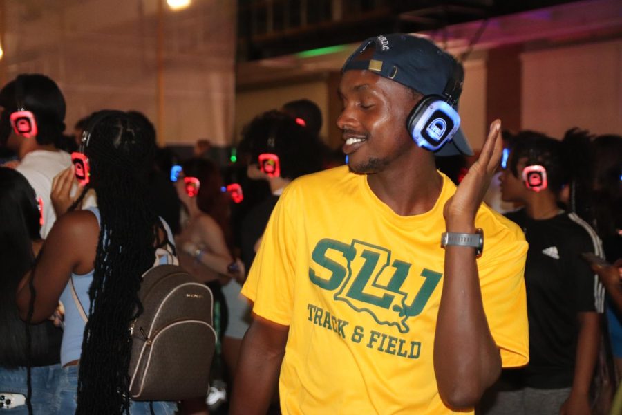 Noah Kiprotich, a sophomore engineering major, gets into the groove at Silent Disco night.