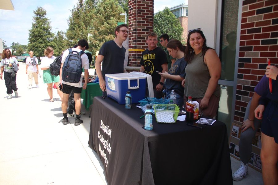 The Baptist Collegiate Ministry hangs out in the Student Union Breezeway during the Back to School BBQ to tell students about the organization.