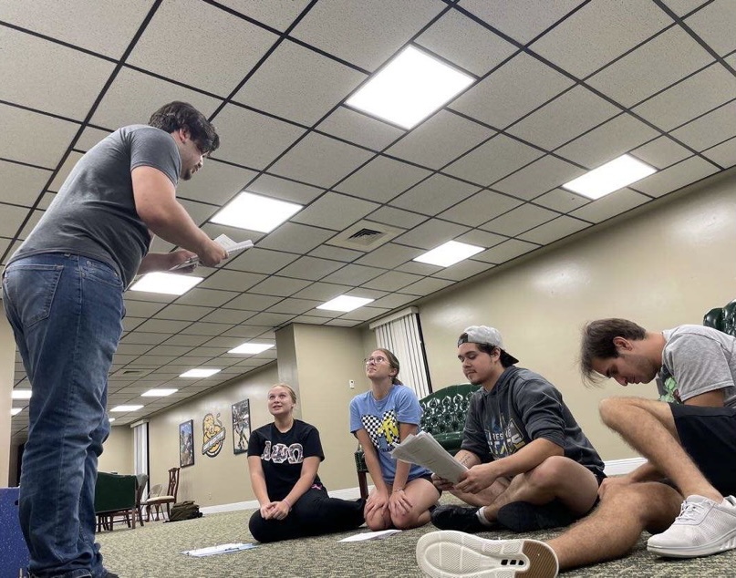 Cast members of The Bald Soprano rehearsing a scene in the University Center. The Bald Soprano will be showing from Sept. 28-30. 