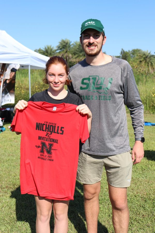 Sophomore Ines Legendre places eighth in the annual Nicholls Invitational Saturday, Sept. 17. (Left is Ines Legendre and right is Distance coach Clayton O’Callaghan).