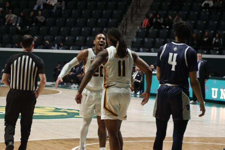 Graduate transfer guards Alec Woodard #20 and Boogie Anderson #11 fired up after one of Andersons buckets during Southeasterns 92-87 victory over UNO Thursday night at the University Center. (Jan. 26, 2023)