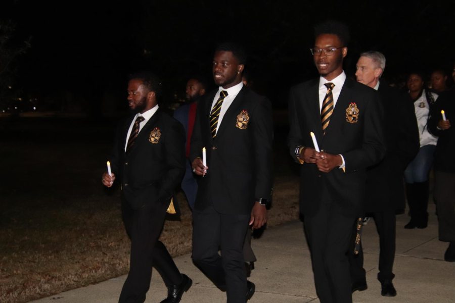 Members of Alpha Phi Alpha fraternity Inc. leading their annual MLK march. Later on, members led a program in the Student Union Theater. 