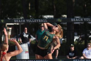 Junior Ysabella Lockwood prepares for devastating spike during Southeasterns Senior Night triumph over William Carey on Tuesday  afternoon at the Southeastern Beach Volleyball Complex. (March 28, 2023)