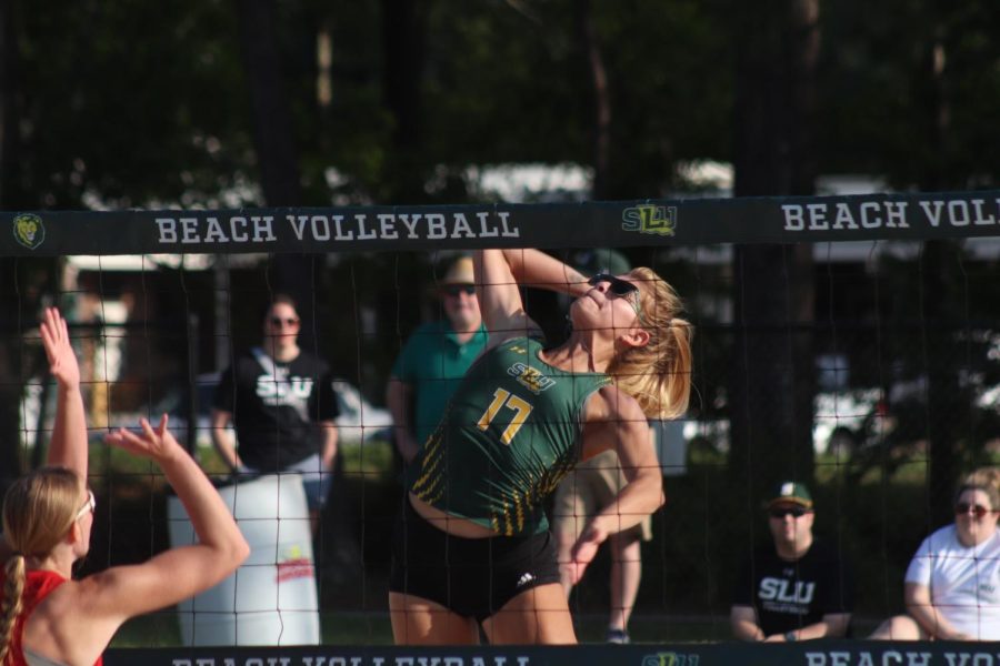 Junior Ysabella Lockwood prepares for devastating spike during Southeasterns Senior Night triumph over William Carey on Tuesday  afternoon at the Southeastern Beach Volleyball Complex. (March 28, 2023)