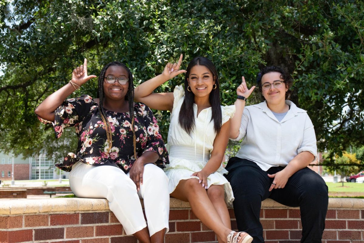 SGA Chief Justice Aaliyah Muhammad, President Lacey Johnson and Vice President Matt Matthews (left to right) show their lion pride by showcasing a fierce “Lion Up.”