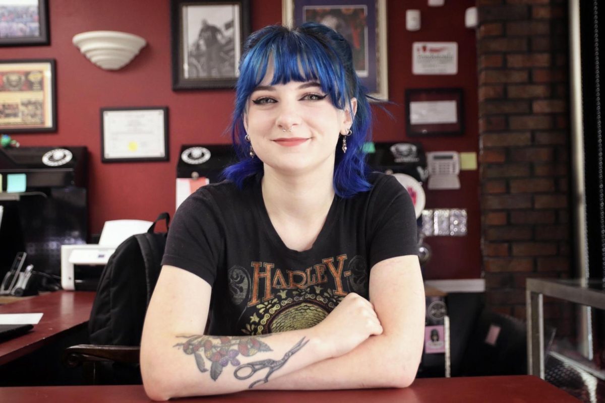 Chloe Williams photo from her feature article on a student balancing life as a tattoo apprentice won 1st Best Feature Photo.