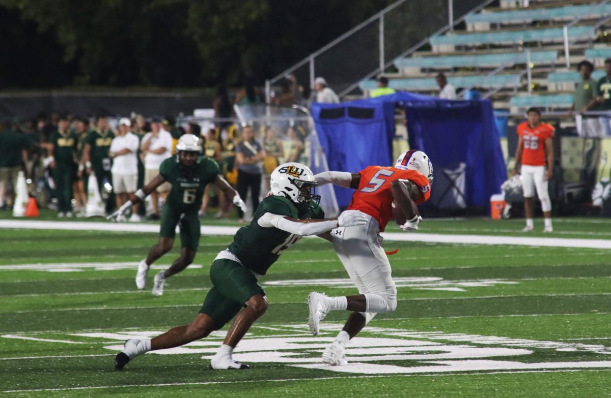 SLUs senior defensive back Victor Tademy tackles Huskies wide receiver Karl Reynolds behind the line of scrimmage for a loss. (Sept. 23, 2023 - Hammond) 