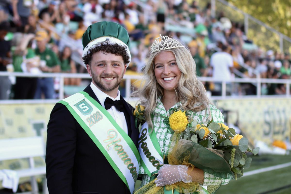 At halftime of the Homecoming football game against Lamar University,   senior kinesiology health major JD McKinney (left) and senior health systems management major Madeline Grippi (right) were named Southeastern 2023 Homecoming King and Queen.
