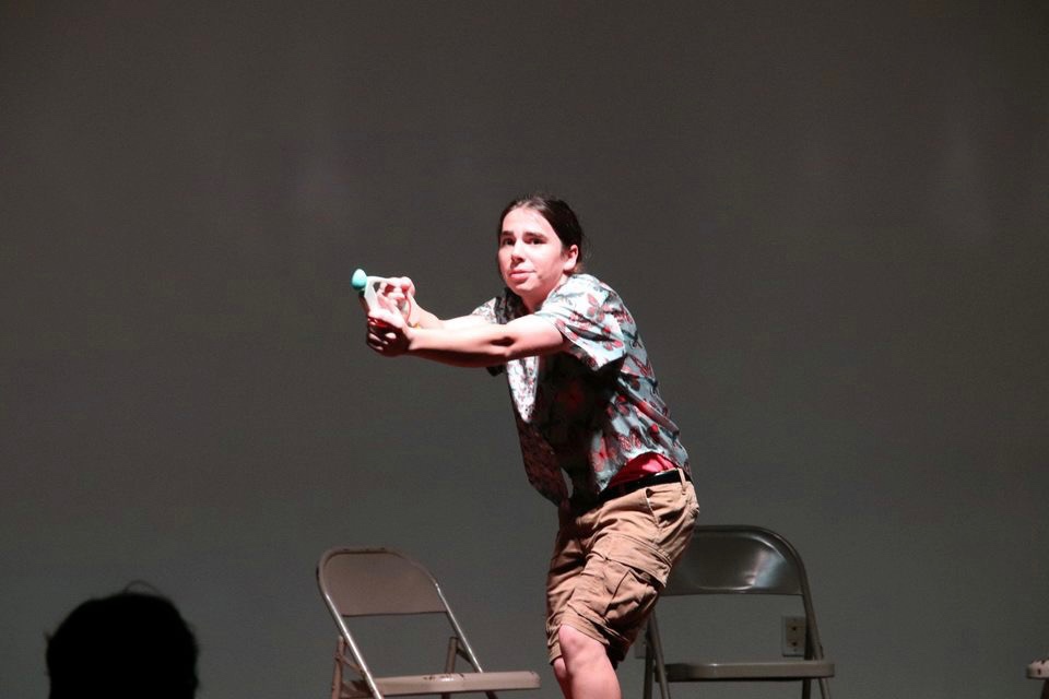 Freshman English education major Daphne Hudson steels herself, using a Bop-It to defend herself during APOs 24-hour theatre festival. 