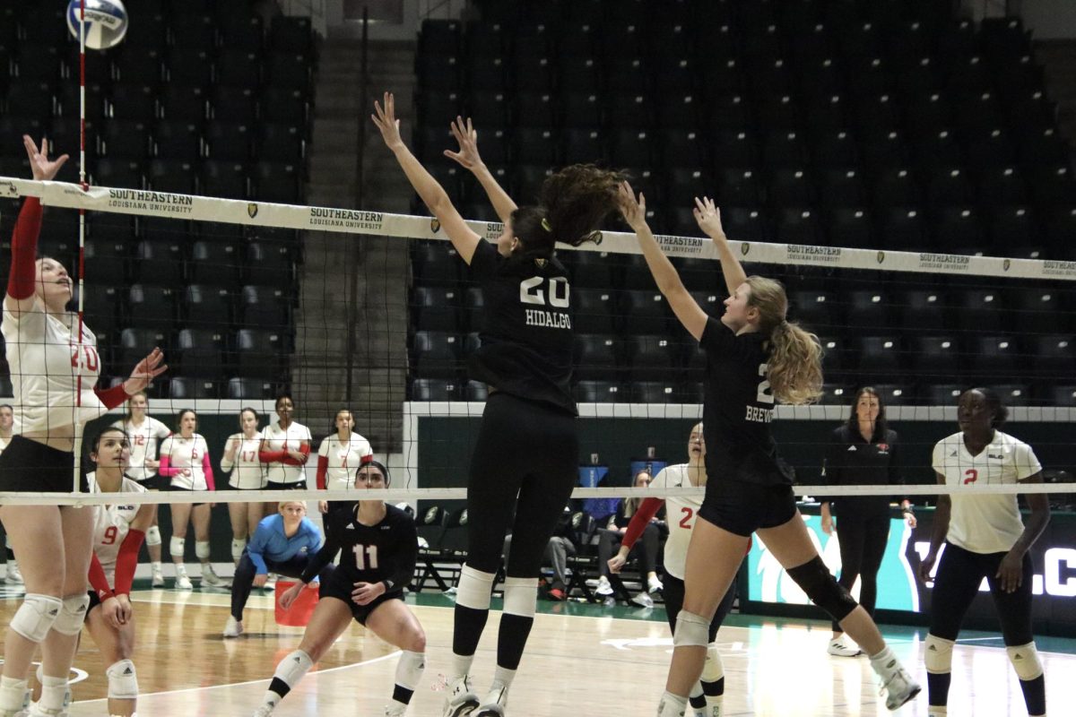 Junior outside hitter Cicily Hidalgo and junior middle hitter Hannah Brewer rise up to defend the UIW offensive attack. (Nov. 2, 2023 - Hammond)