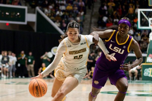 Senior SLU guard Hailey Giaratano makes her move to the basket on sophomore LSU guard Flaujae Johnson during the Lady Lions clash with the Tigers at the Pride Roofing University Center. (Nov. 17, 2023 - Hammond)