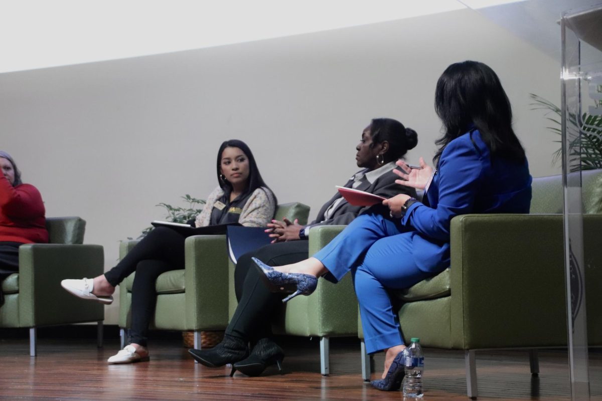 SGA President Lacey Johnson gives her attention to Title IX Coordinator and Title IX panel moderator Teressa Leday.