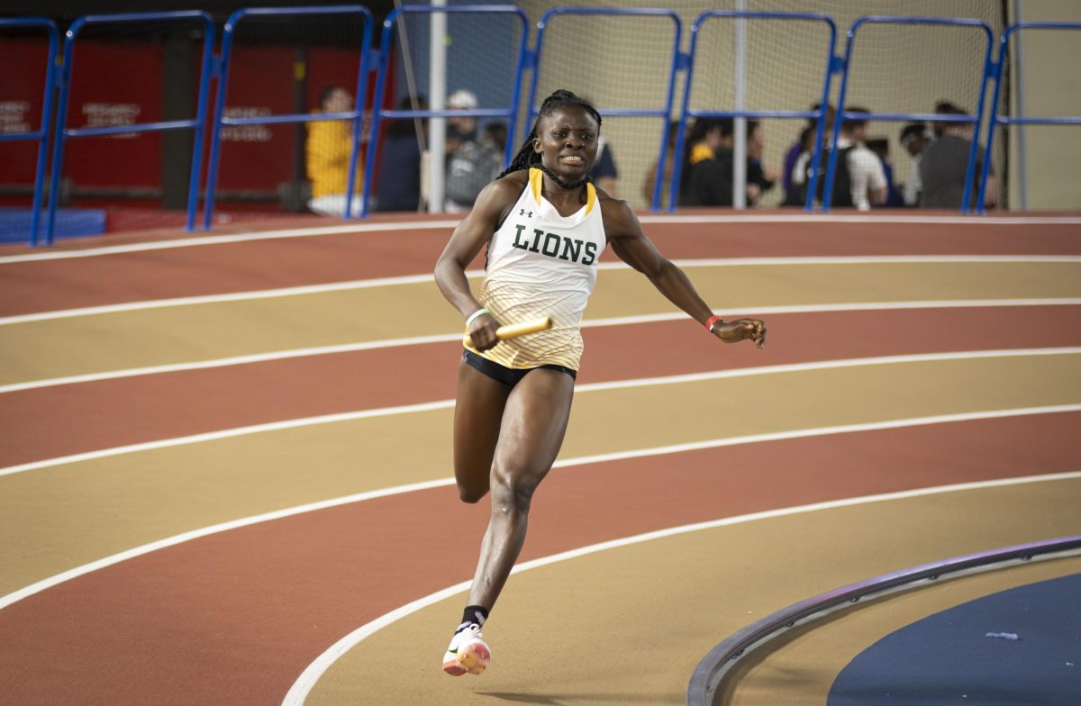 Freshman sprinter Onyah Favour makes her way around the curve as the second leg of the womens 4x400 meter relay.  