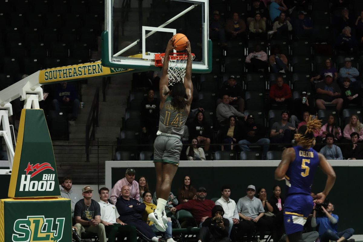 Sophomore SLU forward Dylan Canoville rises for monster fastbreak slam dunk following a steal in the Lions dramatic victory over McNeese at the Pride Roofing University Center. (Feb. 3, 2024 - Hammond)