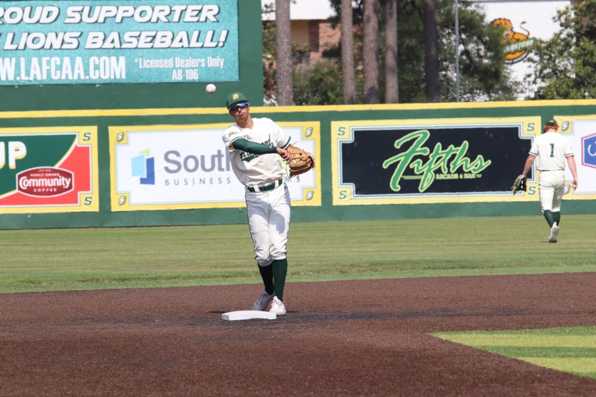 Infielder TJ Salvaggio throws the baseball towards his teammates as they began another inning against McNeese. 