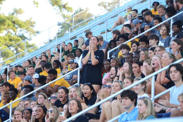 Junior opposite hitter Alexis Logarbo stands among the many Lions students and student athletes cheering for SLU during the annual Strawberry Jam. 