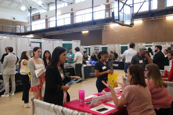 SLU students navigate the Rec, looking for job opportunities and netowrking industry professionals. 