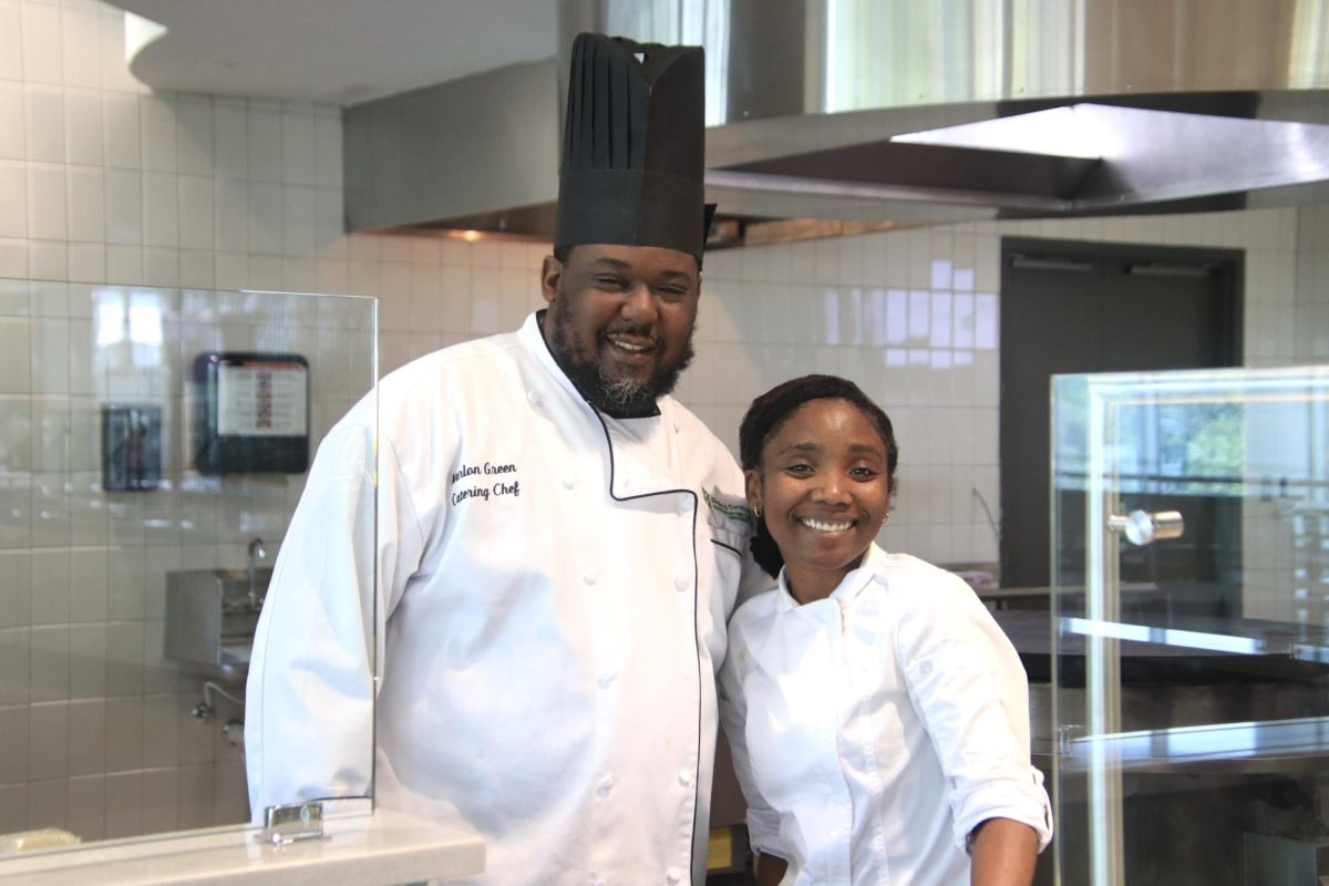 Catering chef Marlon Green and assistant catering chef Charity Butler serve faculty and staff samplings from the newly-renovated Mane Dish following the 2024 Staff/Faculty Convocation.