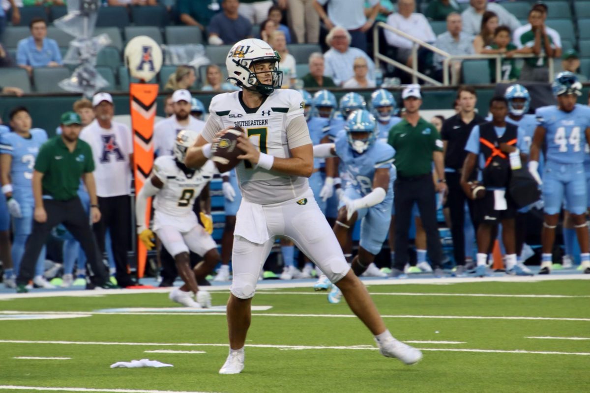 Redshirt junior SLU quarterback Eli Sawyer dropping back to pass against Tulane at Yulman Stadium. Sawyer completed 14/19 pass attempts for 99 yards and an interception in the season-opening loss. (Aug. 29, 2024 - New Orleans)