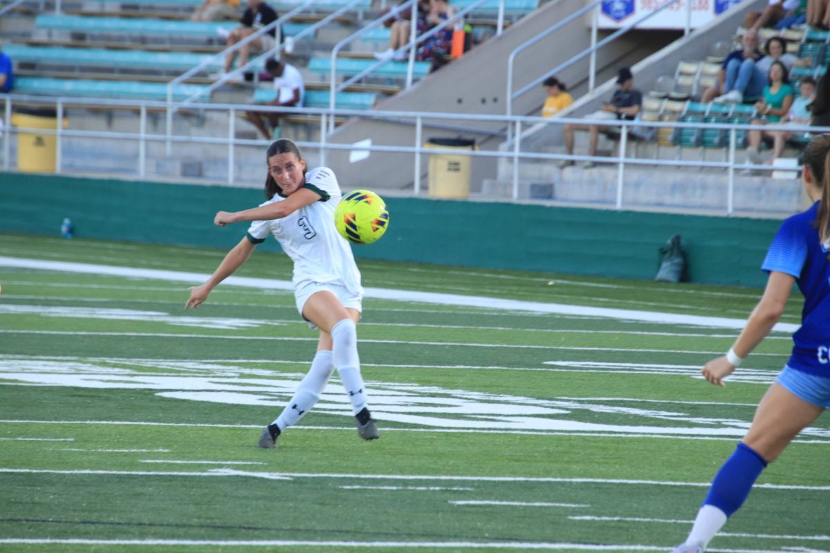 Junior SLU forward Emma Ramsey sends the ball upfield during the Green and Gold's 1-0 win over SLC foe McNeese at Strawberry Stadium. (Hammond - Sept. 22, 2024)