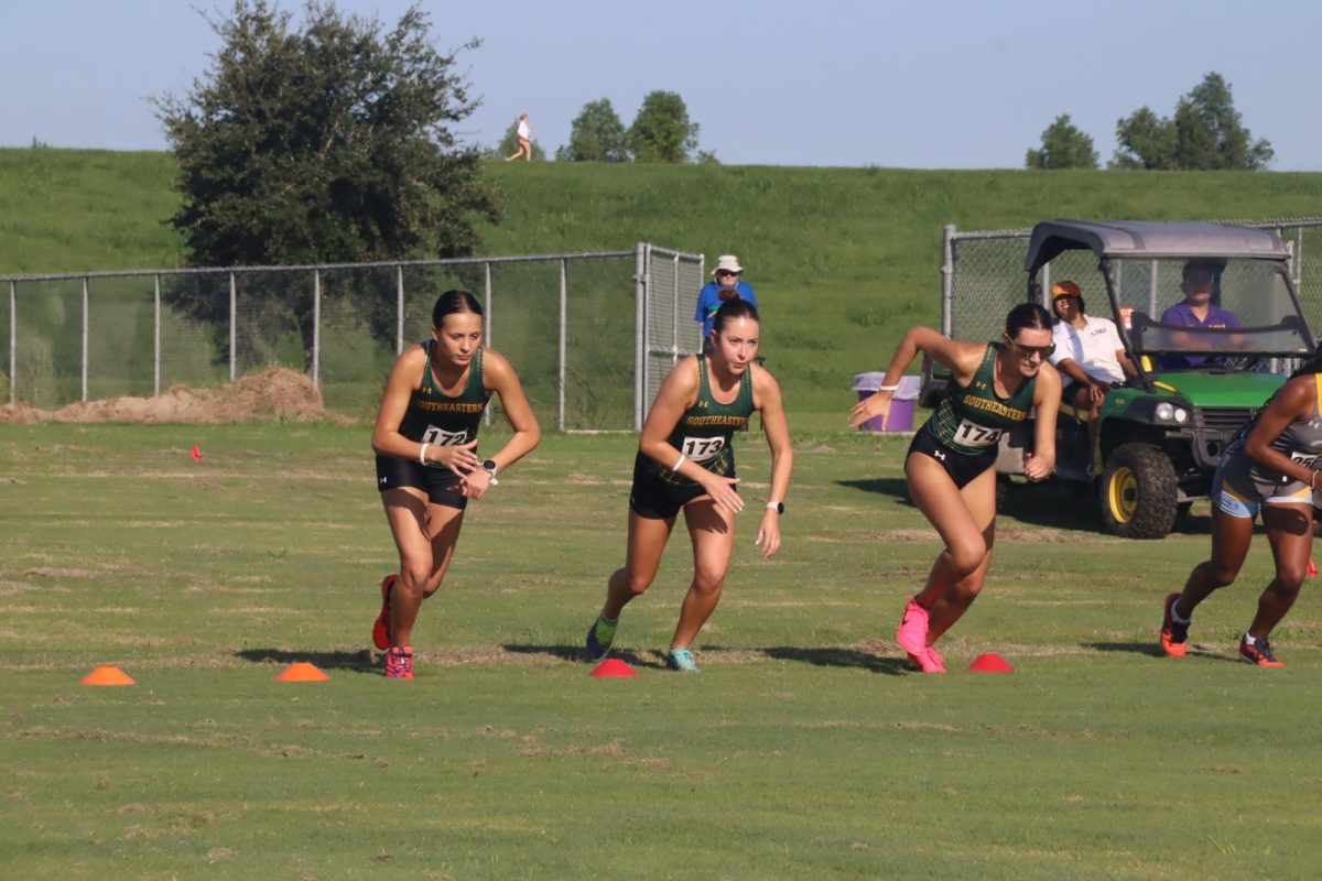 Sophomore Ava Pitarro and freshmen Isabella Latkovich and Cayden Boudreaux fly off the starting line for the Lady Lions. 