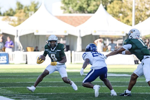 Redshirt senior wide receiver Darius Lewis hauls in the pas before squaring off with a Stephen F. Austin defender in the open field. (Hammond, La. - Saturday, Oct. 19, 2024)