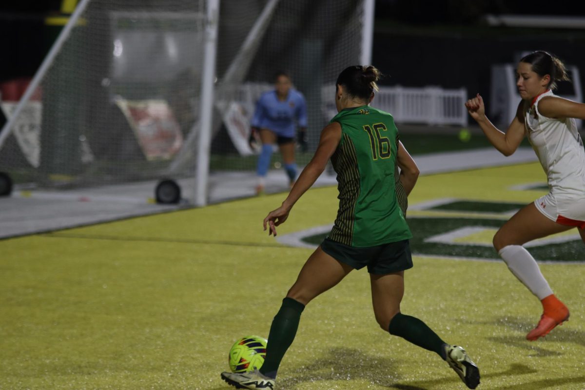 Graudate defender Nicole O'Neill races to the goal while sparring with a UTRGV defender.