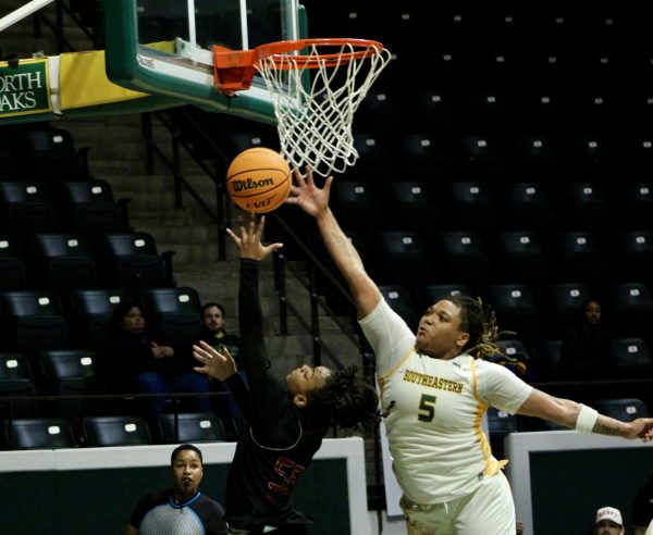  Taylor Bell leaps toward the goal and shuts down the UIW point guard in the Lady Lions' huge win over their SLC rival. (Hammond, La. - Saturday, Jan. 27)