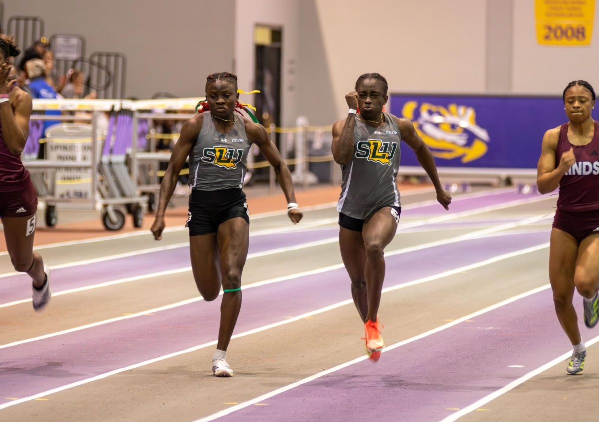 Sophomore sprinters Onyah Favour (left) and Marvellous Asemota (right) fight for the line in the finals for the women's 60-meter. Asemota claimed first place, while Favour secured fourth at the LSU Twilight in Baton Rouge.