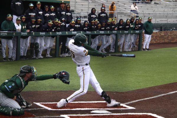 Senior shortstop TJ Salvaggio strokes a double to right center in the first inning at Tulane. 