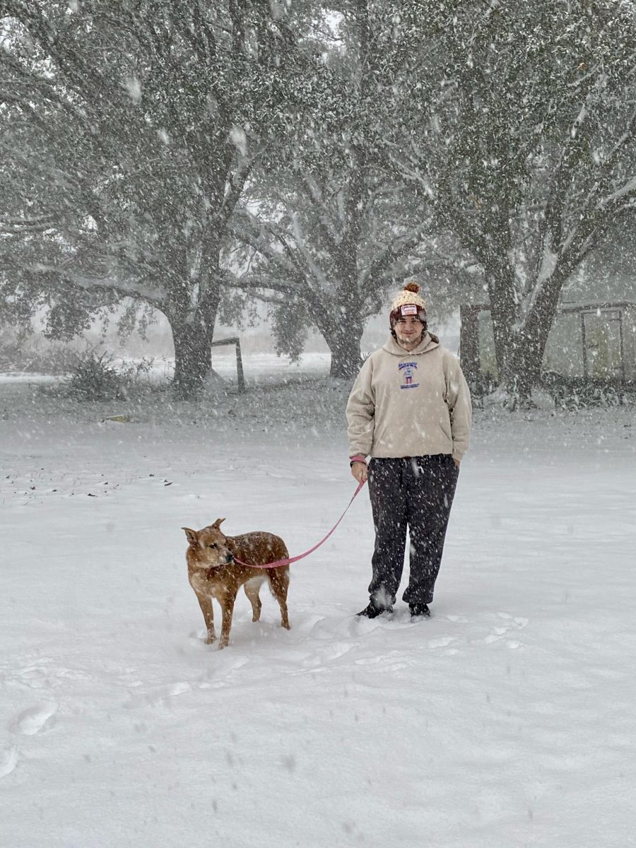 Junior sports communication major Sean Hoffman enjoyed the snow with his pet.