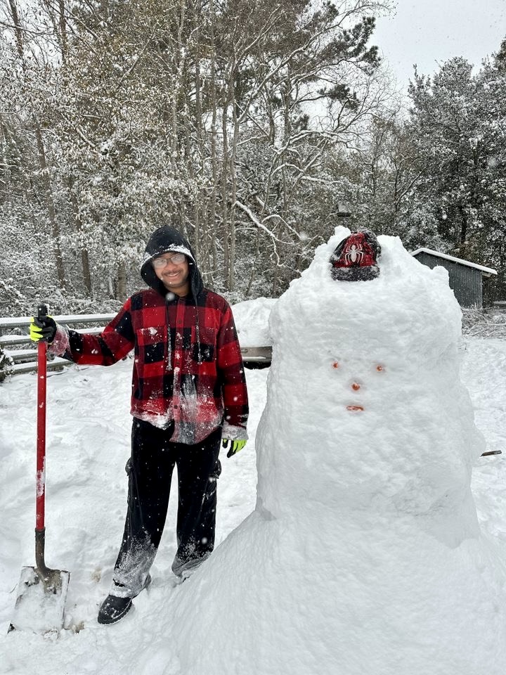 Southern Louisiana received so much snow that computer science major Aaron Madison was able to build a snowman as big as him!