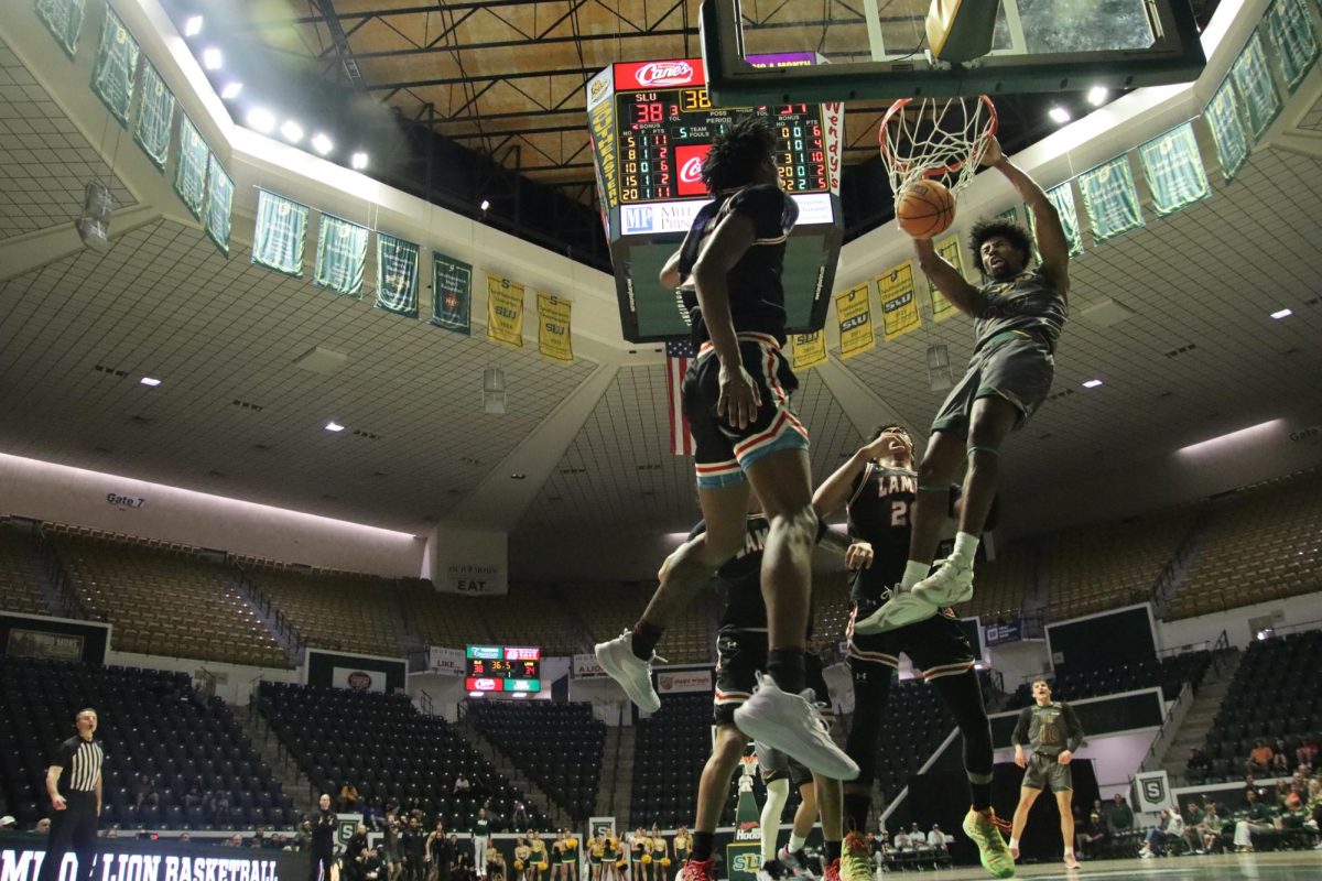 Senior Southeastern guard Sam Hines Jr. flushes dunk with authority versus Lamar at the University Center. (Feb. 3, 2025 - Hammond) 