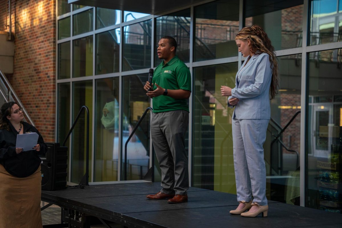 SGA Chief Justice candidates Raydan Riley and Kayla Edwards speak to students during the Meet the Candidates forum in the Student Union Breezeway.