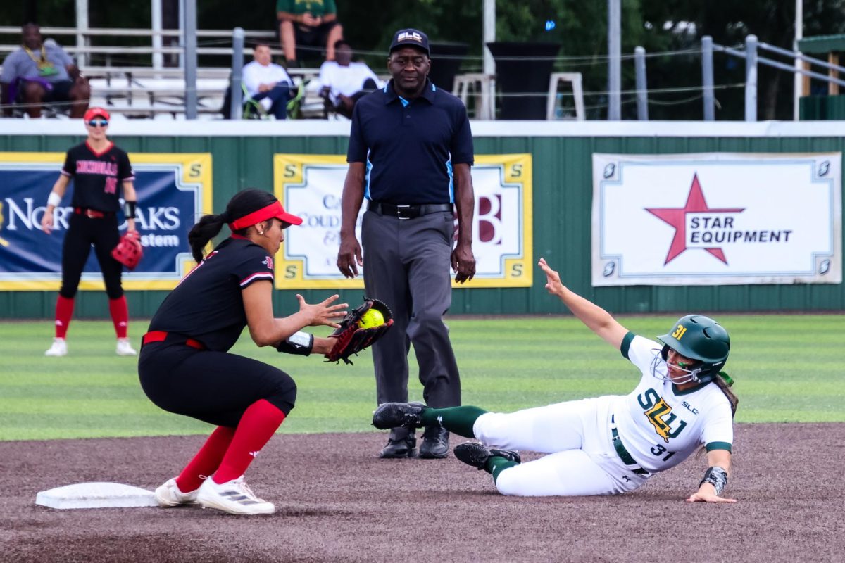 Senior outfielder Ariel Gomez slides into second base during the Lady Lions' matchup against Nicholls.