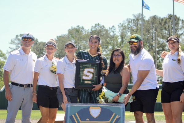 Senior outfielder Maddie Leal celebrates her Senior Day with family and the softball coaching staff before taking the field against Stephen F. Austin. (Hammond, La. - North Oak Park, Saturday, April 12)