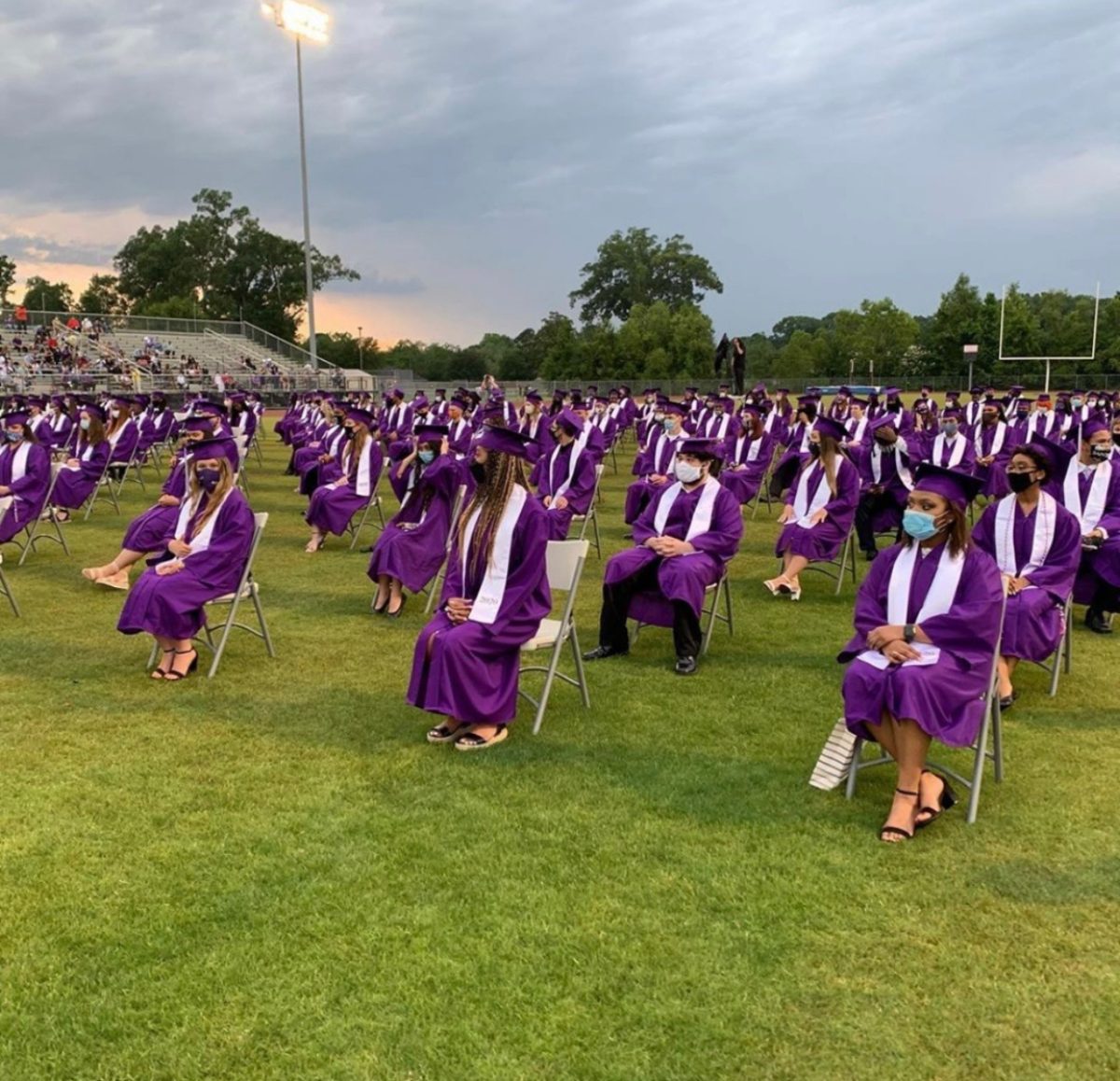 Woodlawn High School graduates sit six feet apart awaiting the ceremony to commence. (May 2020)